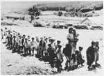 [Possibly a group of Serbian children being marched to a concentration camp].