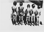 Five naked, emaciated children pose outside with their backs to the camera at the Jastrebarsko concentration camp.