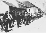 Serbian villagers from the Kozara region who have been rounded-up for deportation, march in a column through the streets of Prijedor.