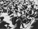 A large group of young Serbian children from the Kozara region who are dressed in Ustasa uniform, are assembled at the Stara Gradiska concentration camp.