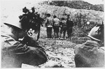 Italian soldiers take aim at a group of unidentified prisoners they are about to shoot.