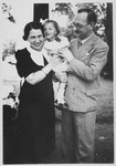 Portrait of a Jewish family in Budapest.

Pictured are Lorand and Ella Schichtanz with their daughter, Judit.