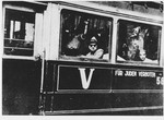 Civilians ride a streetcar in Belgrade that is marked "Fuer Juden Verboten" (Forbidden to Jews).