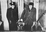 A Swedish policeman accompanies a newly arrived Danish-Jewish refugee to the welfare office in Rebslagergade.
