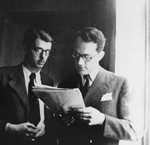 Varian Fry (right) shows a document to his associate, Daniel Benedite, in the offices of the Centre Americain de Secours.