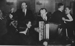 Oskar Schindler at a dinner party in Krakow.  At parties like this, Schindler made contact with various SS and German officials, which often led to tips about impending deportations that enabled him to save his laborers.