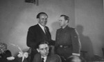 Oskar Schindler at a dinner party in Krakow with an SS officer.