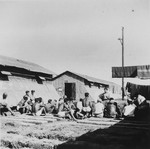 Prisoners gather outside their barracks in the Gurs concentration camp in France.
