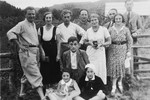 The Kimelman family poses with a group of friends while on vacation.