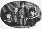 Studio portrait of four Jewish children in Chechersk, Belarus.