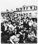Members of the Buchenwald children's transport pose outside the Ecouis children's home.
