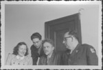 Interpreters working for the IMT Nuremberg commission investigating indicted Nazi organizations pose with Russian prosecutor Colonel Orlov.