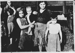 Group portrait of women and children in the Pecana camp in Sisak (near the village of Goldovo).