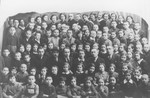 Group portrait of students and teachers in a Jewish school in Telsiai, Lithuania.