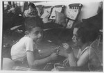 Two young Jewish refugee children play together on the deck of the MS St.