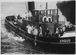Relatives of passengers aboard the MS St. Louis approach the refugee ship in a tugboat called the Argus.
