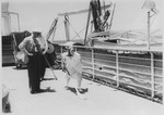 Passengers play shuffleboard on the deck of the MS St.