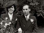 Portrait of Lore Gotthelf and Erwin Jacobowitz outside the Buckland Crescent synagogue in London, after their wedding.