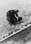 A woman street cleaner in the Lodz ghetto.