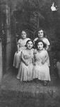 Group portrait of four female members of the Ovici family, a family of Jewish dwarf entertainers known as the Lilliput Troupe, who survived Auschwitz.