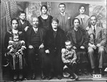 Unidentified family portrait.  Eight adults and three children.