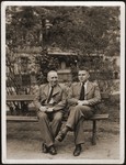 Walter and Siegfried Jacobsberg sit on a park bench in Berlin.