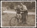 Gutman Gryniewicz and his son, Adam, pose for a picture, during a parents day in the sanatorium for Jewish children in Srodborow, near Warsaw.