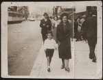 Pola Jakubowicz walks in the street with her nephew, Ester's son, Maurice Szykman.