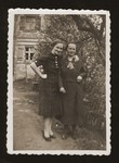 Flora Winter and her older sister, Marta, pose outside their home in Wittelshofen, Germany.