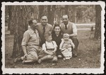 Mania Gryniewicz, seated, with her children, Hania and Adam.
