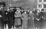 Group portrait of Jews from Vienna in front of a home for the elderly in the Kielce ghetto.
