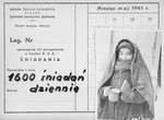 An identification card bearing a photo of a child holding a cup and a piece of bread in the Kielce ghetto.