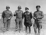 American and Soviet generals pose on the banks of the Elbe River near Torgau, Germany, where the two Allies linked up for the first time.