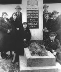 Members of the Szczukowski family pose by the grave of Hynda Szczukowski.