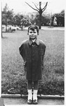 Portrait of a Czech Jewish boy standing outside.

Pictured is Peter Lederer, who later perished in Auschwitz.