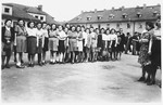 Teenagers from the Beit Yaakov religious school for girls, line-up for a Zionist demonstration in the Bergen-Belsen displaced persons camp.