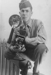 Paul Averitt, a member of the US Army 92nd Signal Corps Battalion poses with his camera.