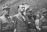 Hungarian soldiers lead former minister Lajos Remenyi-Schneller to execution in the courtyard of the Budapest Academy of Music.