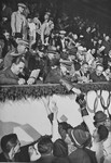 Adolf Hitler and Josef Goebbels sign autographs for members of the Canadian figure skating team at the 1936 Olympics.