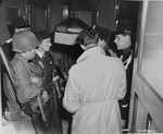 Members of the Dutch resistance, the Dutch police, and an American soldier search for uniforms and weapons belonging to Dutchmen suspected of collaborating with the Germans during the occupation.