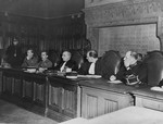 The members of a Belgian court hear the charges against five women accused of collaborating with the Germans during the occupation.