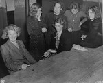Women accused of collaborating with the Germans await their fate after being arrested by the Dutch resistance.