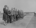 Ten German prisoners held in the Recklinghausen internment camp wait to be questioned by American investigators from the U.S.