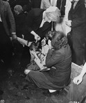 Members of the French resistance in Cherbourg shear the hair of women who collaborated with the Germans during the occupation.