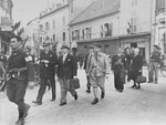Members of the Free French Forces of the Interior (FFI, Forces Francaises de l'Interieur) lead the Judge and Mayor of Vesoul to prison for collaborating with the Germans.