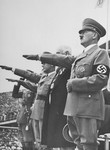 Adolf Hitler saluting the Olympic flag at the opening of the 1936 Olympic Games.