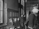 Belgian women accused of  collaborating with the Germans wait in the Liege Palace of Justice for a court to decide their fate.