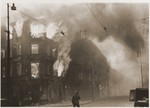 A housing block burns during the suppression of the Warsaw ghetto uprising.