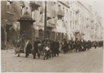 Jews captured during the suppression of the Warsaw ghetto uprising are marched off to the Umschlagplatz for deportation.