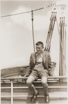 Walter Karliner sits on the railing of the MS St.